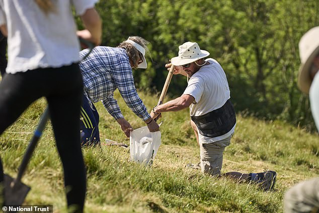 Experts restore Britain's iconic Cerne Abbas Giant with 17 tonnes of chalk.