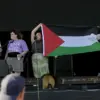 Controversial Palestinian Flag Display at Festival Sparks Debate on Free Speech and Government Oversight